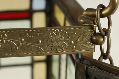 Lot 611 - A LATE 19TH CENTURY BRASS AND STAINED GLASS HALL LANTERN
