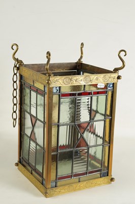 Lot 611 - A LATE 19TH CENTURY BRASS AND STAINED GLASS HALL LANTERN