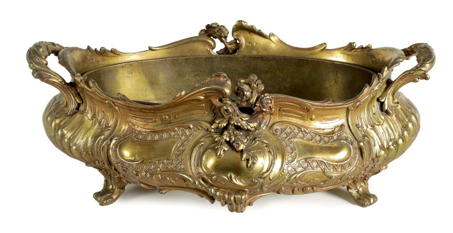 Lot 672 - A 19TH CENTURY FRENCH CAST GILT METAL RECOCO STYLE OVAL TWO-HANDLED SHALLOW JARDINERE AND LINER