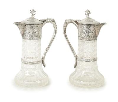 Lot 558 - A GOOD PAIR OF LATE VICTORIAN SILVER-MOUNTED CUT GLASS CLARET JUGS