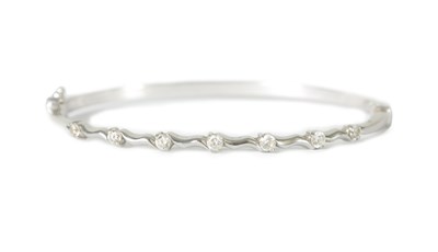 Lot 411 - AN 18CT WHITE GOLD DIAMOND BANGLE