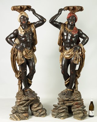 Lot 1451 - A PAIR OF 19TH CENTURY CARVED POLYCHROME DECORATED BLACKAMOORS