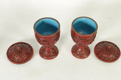 Lot 231 - A PAIR OF 18TH/19TH CENTURY CHINESE CINNABAR LACQUER URN-SHAPED LIDDED VASES