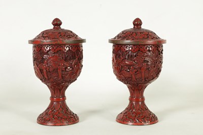 Lot 231 - A PAIR OF 18TH/19TH CENTURY CHINESE CINNABAR LACQUER URN-SHAPED LIDDED VASES