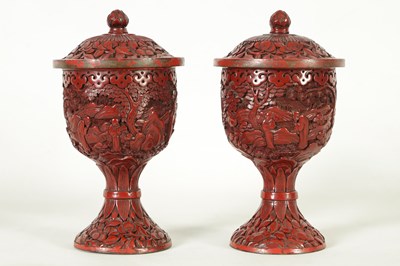 Lot 231 - A PAIR OF 18TH/19TH CENTURY CHINESE CINNABAR LACQUER URN-SHAPED LIDDED VASES