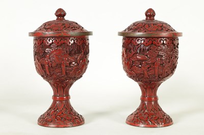 Lot 231 - A PAIR OF 18TH/19TH CENTURY CHINESE CINNABAR LACQUER URN-SHAPED LIDDED VASES