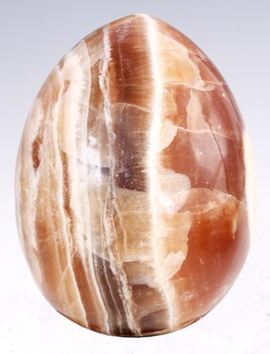 Lot 175 - A LARGE BROWN VIENED MARBLE EGG 14cm diameter...