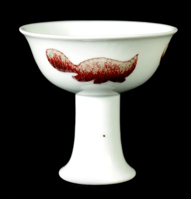 Lot 194 - A CHINESE PORCELAIN COPPER RED “FISH” STEMCUP