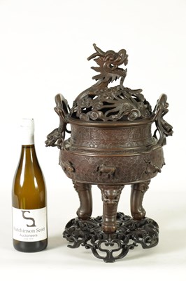 Lot 156 - A 19TH CENTURY CHINESE BRONZE CENSER AND LID MOUNTED ON A HARDWOOD STAND