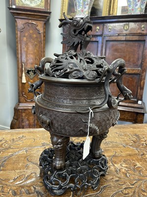 Lot 156 - A 19TH CENTURY CHINESE BRONZE CENSER AND LID MOUNTED ON A HARDWOOD STAND