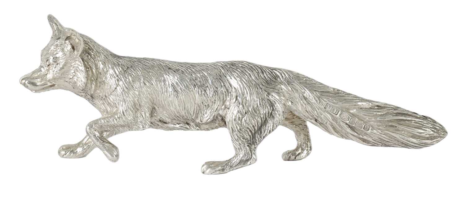 Lot 513 - A SOLID SILVER CAST MODEL OF A PROWLING FOX