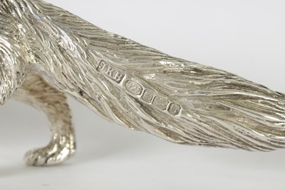 Lot 513 - A SOLID SILVER CAST MODEL OF A PROWLING FOX