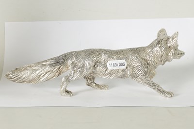 Lot 513 - A SOLID SILVER CAST MODEL OF A PROWLING FOX