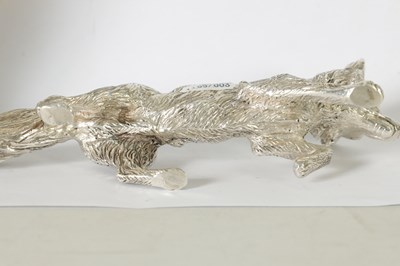 Lot 513 - A SOLID SILVER CAST MODEL OF A PROWLING FOX