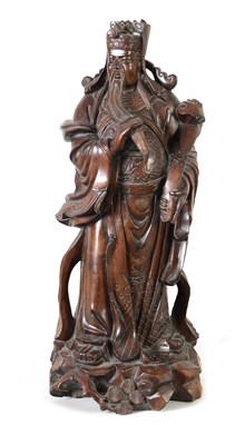 Lot 322 - A LATE 19TH CENTURY CHINESE CARVED HARDWOOD FIGURAL SCULPTURE OF AN EMPEROR