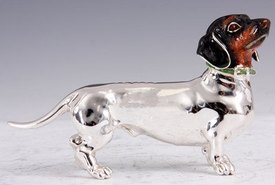 Lot 186 - A SILVER AND ENAMEL DACHSHUND with brown...