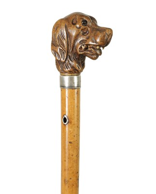 Lot 640 - AN EARLY 19TH CENTURY CARVED BLACK FOREST DOGS HEAD WALKING CANE