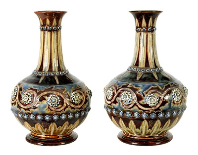 Lot 92 - A GOOD PAIR OF DOULTON LAMBETH FOOTED BULBOUS FLARED NECK VASES BEARING MONOGRAM FOR GEORGE TINWORTH