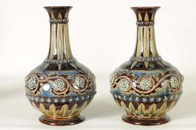 Lot 82 - A GOOD PAIR OF DOULTON LAMBETH FOOTED BULBOUS FLARED NECK VASES BEARING MONOGRAM FOR GEORGE TINWORTH