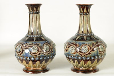 Lot 92 - A GOOD PAIR OF DOULTON LAMBETH FOOTED BULBOUS FLARED NECK VASES BEARING MONOGRAM FOR GEORGE TINWORTH