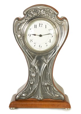 Lot 1147 - A GOOD ART NOUVEAU SILVER-MOUNTED MAHOGANY BALLOON-SHAPED MANTEL CLOCK