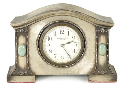 Lot 1193 - AN ARTS AND CRAFTS PEWTER-CASED MANTEL CLOCK