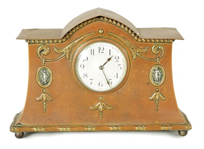 Lot 1213 - AN ARTS AND CRAFTS COPPER AND BRASS CASED MANTEL CLOCK