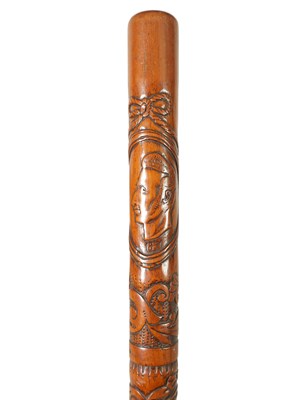 Lot 647 - A LATE 19TH CENTURY RELIEF CARVED AMERICAN WALKING CANE