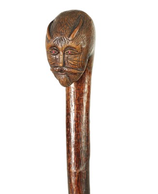 Lot 674 - A LATE 19TH CENTURY FOLK ART CARVED HEAD WALKING CANE