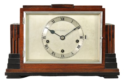 Lot 1165 - AN ART DECO CALAMANDER AND MAHOGANY QUARTER STRIKING MANTEL CLOCK