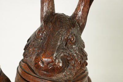Lot 757 - A LARGE AND RARE 19TH CENTURY BLACK FOREST CARVED LINDEN WOOD TOBACCO JAR FORMED AS A FOX AND HARE