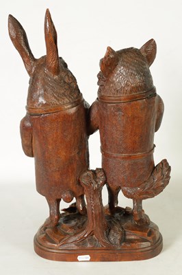Lot 757 - A LARGE AND RARE 19TH CENTURY BLACK FOREST CARVED LINDEN WOOD TOBACCO JAR FORMED AS A FOX AND HARE