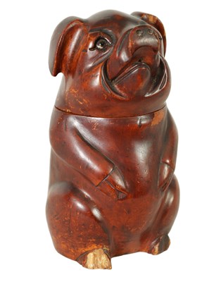 Lot 747 - A 19TH CENTURY CARVED FRUIT WOOD TOBACCO JAR FORMED AS A STANDING PIG