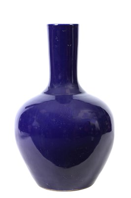 Lot 208 - AN OVERSIZED 19TH CENTURY CHINESE MONOCHROME BLUE-GLAZED BOTTLENECK VASE