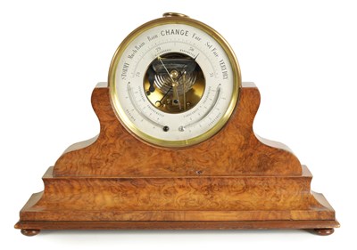 Lot 872 - A 19TH CENTURY BRASS CASED ANEROID BAROMETER ON A FIGURED WALNUT STAND