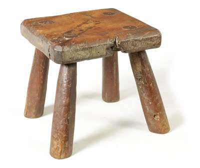 Lot 1378 - A 19TH CENTURY PRIMITIVE ELM STOOL