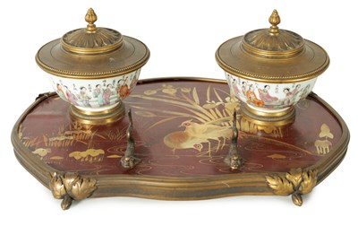 Lot 220 - A 19TH CENTURY DARK RED AND GOLD LACQUER WORK ORMOLU MOUNTED INKSTAND