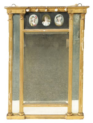 Lot 1407 - A REGENCY CARVED GILT WOOD PIER MIRROR WITH BERLIN PORTRAIT PLAQUES