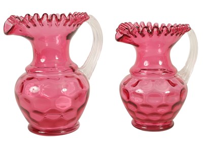 Lot 4 - A GRADUATED PAIR OF 19TH CENTURY STYLE OVERSIZED CRANBERRY GLASS JUGS