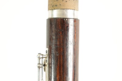Lot 646 - A MID 19TH CENTURY WOODEN FLUTE BY RUDALL, CARTE & CO. NO. 385.