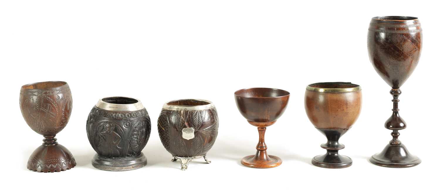 Lot 1139 - A COLLECTION OF SIX LATE 18TH CENTURY CARVED COCONUT AND TREEN WARE CUPS