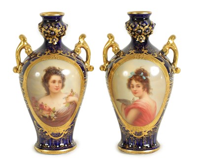 Lot 107 - A PAIR OF LATE 19TH CENTURY VIENNA STYLE GILT AND ROYAL BLUE GROUND TWO-HANDLED CABINET VASES