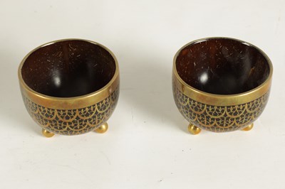 Lot 589 - A PAIR OF BRASS INLAID COCONUT SHELL BOWLS