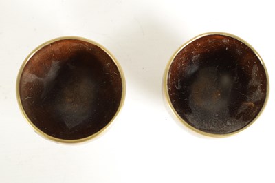 Lot 589 - A PAIR OF BRASS INLAID COCONUT SHELL BOWLS