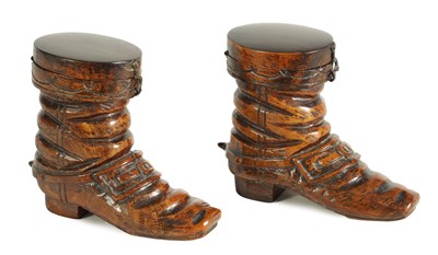 Lot 876 - A PAIR OF 19TH CENTURY CARVED OLIVEWOOD BOOT INKWELLS