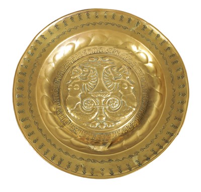 Lot 525 - A 16TH CENTURY NUREMBERG BRASS ALMS DISH