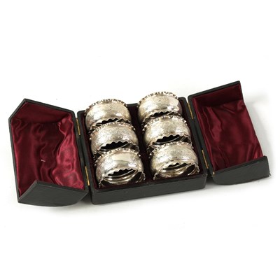 Lot 298 - A CASED SET OF SIX VICTORIAN SILVER SERVIETTE RINGS