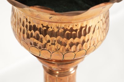 Lot 554 - AN ARTS AND CRAFTS COPPER JARDINIERE ON STAND