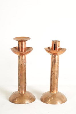 Lot 553 - A PAIR OF ARTS AND CRAFTS NEWLYN SCHOOL COPPER CANDLESTICKS