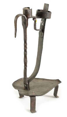 Lot 527 - AN 18TH CENTURY IRON CANDLE HOLDER